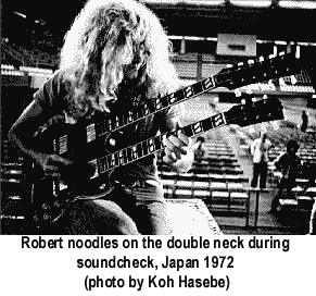 Robert Plant Playing a Double Neck Guitar